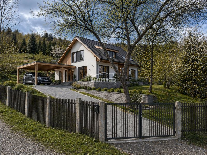 A house with a garden and a gazebo in Krásno nad Kysucou intended for residential plots.