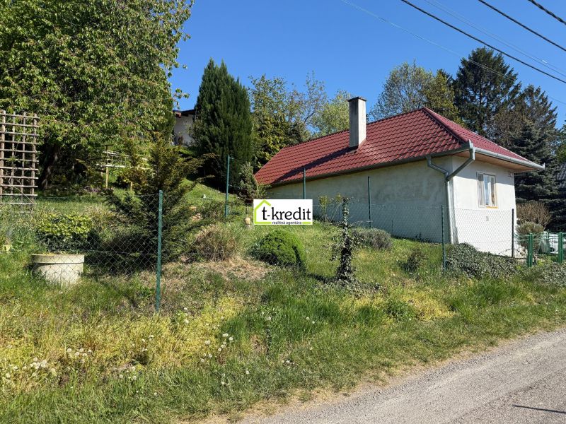 A family house in Čaradice with a garden, surrounded by greenery and nature.