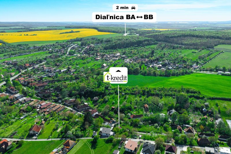 Aerial view of family houses in Čaradice surrounded by green areas and nature.
