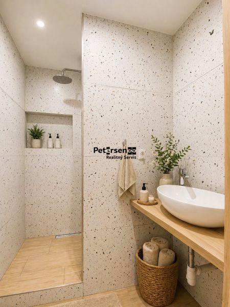 The bathroom of a 2-room apartment with terrazzo walls, a shower corner, and cozy decoration.