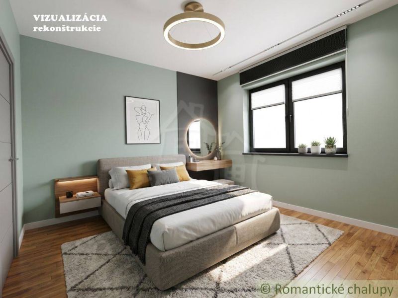 Bedroom in a family house with wood-patterned flooring, light green walls, bed, window.