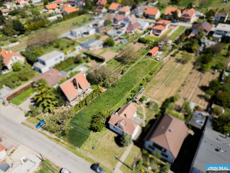 A summer view of residential plots on Nová Street in Viničné.