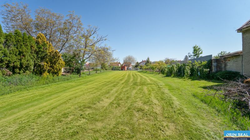 Land on Nová Street in Viničné, designated for residential use, with a manicured lawn.