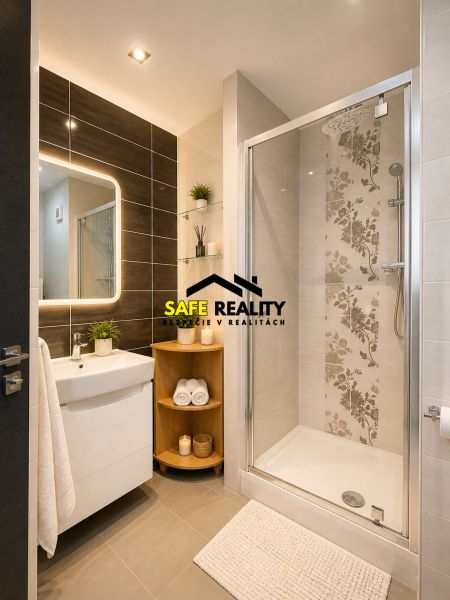 Bathroom in a 3-room apartment with ceramic tiles, a shower, and a mirror with lighting.