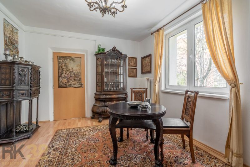 Interior of a 4-room apartment, historical furniture and floor with wooden decor.