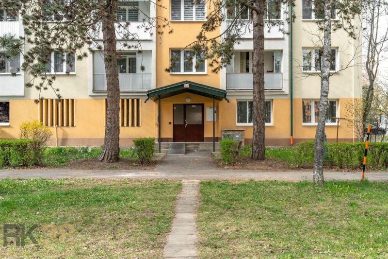 The entrance to the apartment building on Štúrová Street in Poprad, surrounded by greenery.