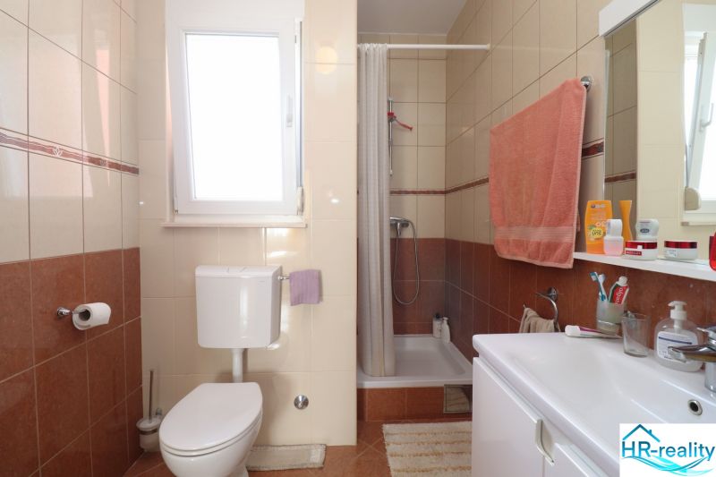Bathroom with a shower in a family house.