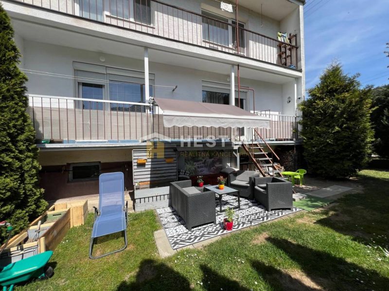 A garden at a 3-room apartment in Brezová pod Bradlom with outdoor seating and greenery.