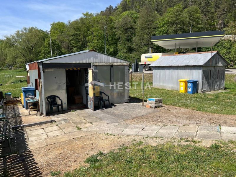 Metal garages and a washing center in the garden in Brezová pod Bradlom, surrounded by nature.