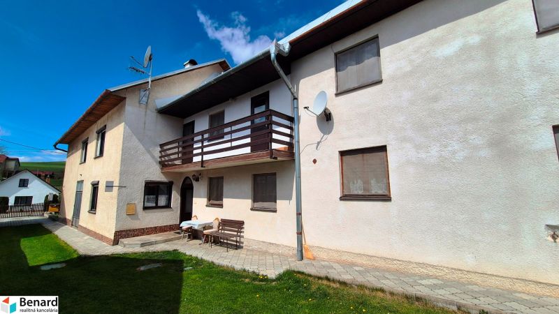 A family house in Jarabina on Jarabina Street with a balcony and a landscaped garden.