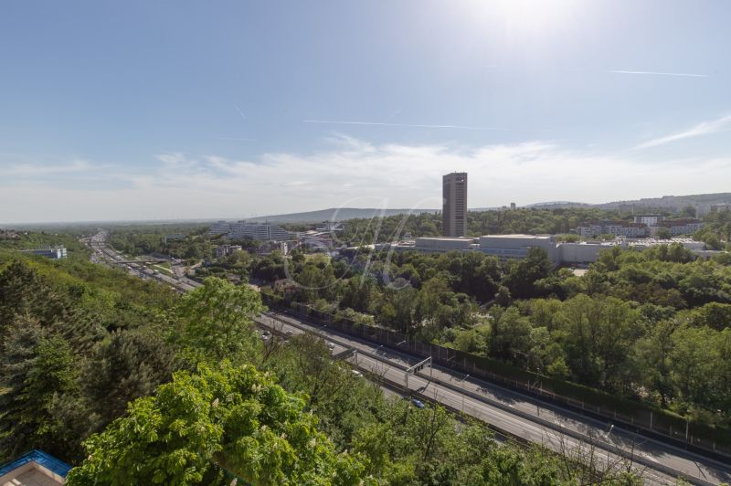 View of greenery and roads from a 4-room apartment on Martinengova Street.