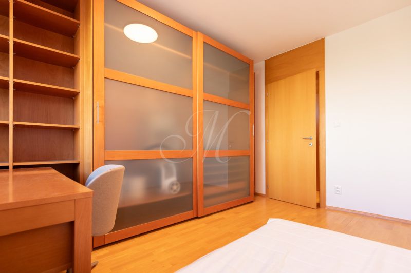 Children's room in a 4-room apartment with storage space and a wooden decor floor.