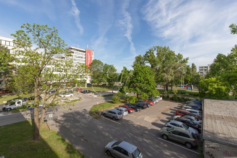 View of the parking lot and greenery on Exnárova Street in Bratislava - Ružinov.