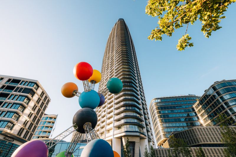 A high-rise building with a colorful sculpture on Pribinova Street in Bratislava - Old Town.