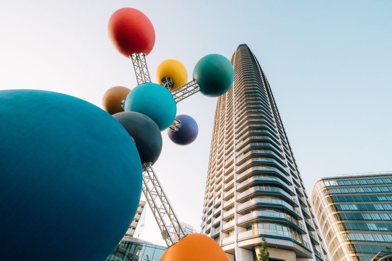 Colorful sculpture and skyscraper during the construction of apartments on Pribinova in Bratislava - Ružinov.