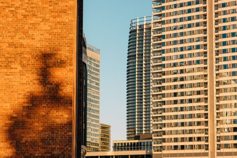 High-rise buildings with glass facades in Bratislava - Ružinov at sunset.