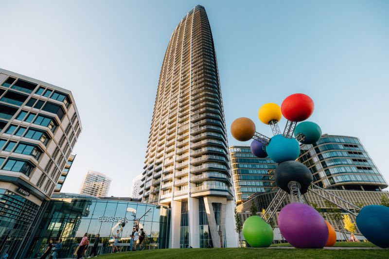 Construction of apartments on Pribinova Street in Bratislava - Ružinov with a colorful sculpture in the foreground.