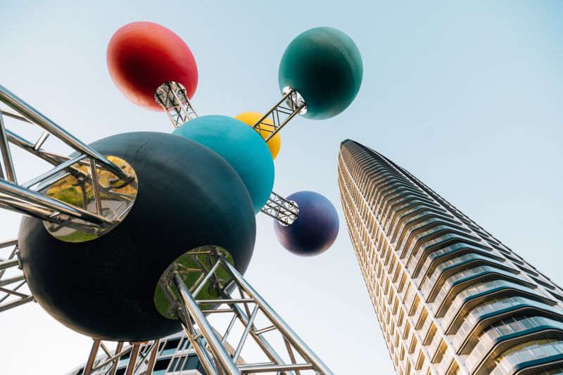 Colorful sculpture and modern high-rise building, Residential construction.