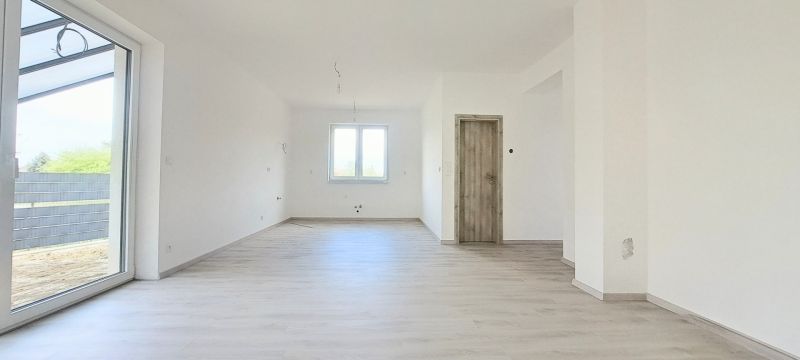 Interior of a family house with a window and a wooden decor floor.