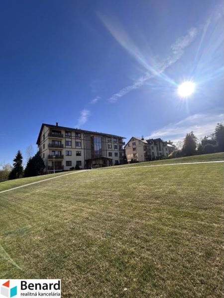 Buildings and grassy area in Stará Lesná, on Stará Lesná street, near a 3-room apartment.