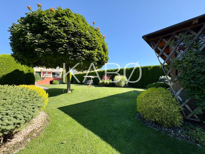 A well-maintained garden with a gazebo at a family house in Partizánske.