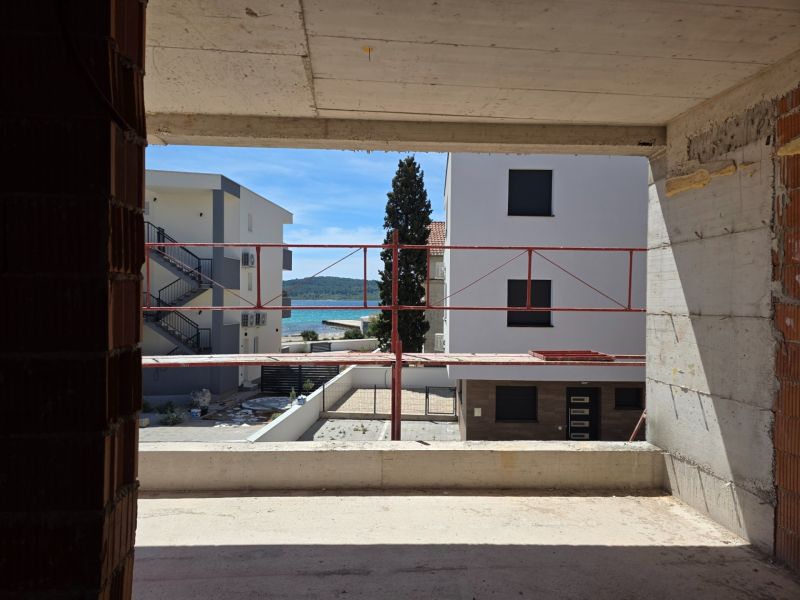 View from a 3-room apartment in Srima of the sea and surrounding buildings.