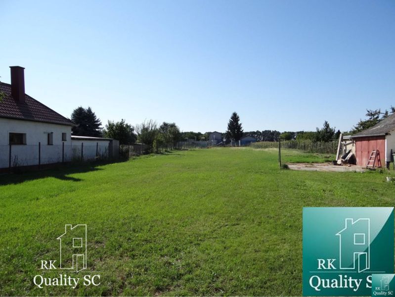 Building plot for residential use in Galanta, Jelka - Vrbová, with a flat grassy area.