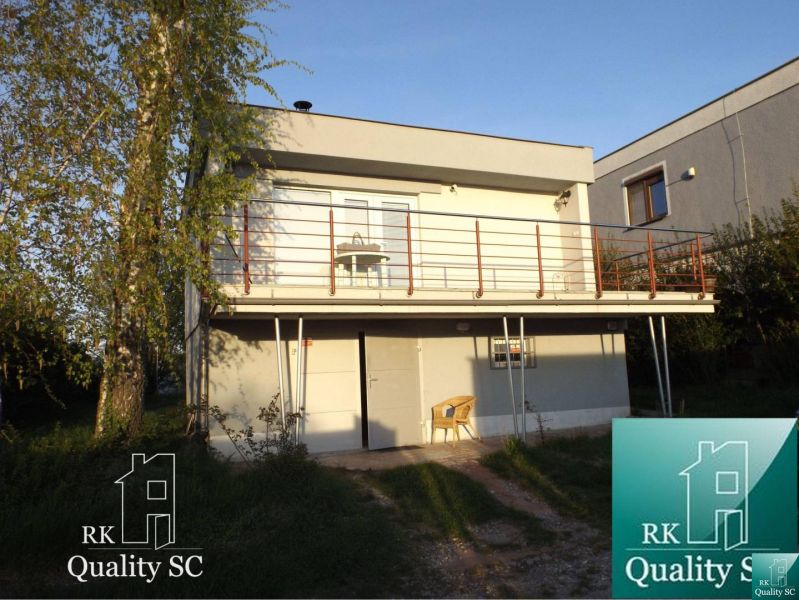 Cottage at SUNNY LAKES SOUTH in Senec with a garden and terrace.