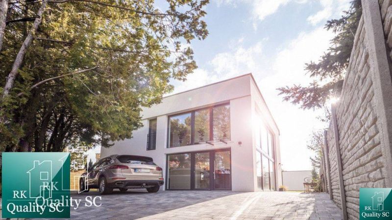Family house at Sunny Lakes South in Senec with adjacent parking and greenery.