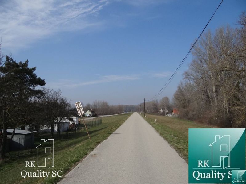 Road in the location of Old Port Gabčíkovo, lined with trees and grass, Land - residential.