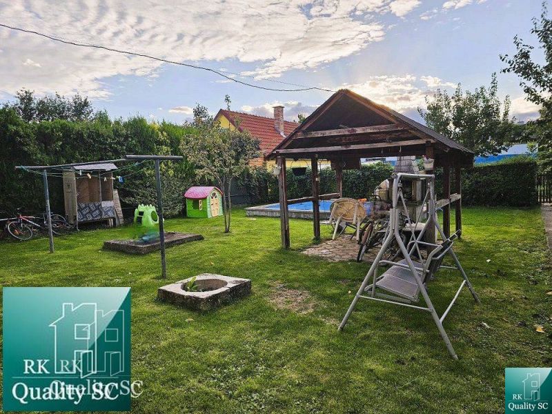 A family house in the town of Tureň with a garden gazebo, swing, and children's playground.
