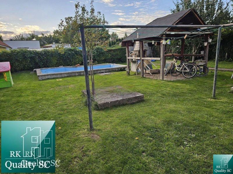 Garden in the town of Tureň by a family house on Tureň street with a gazebo and a swimming pool.