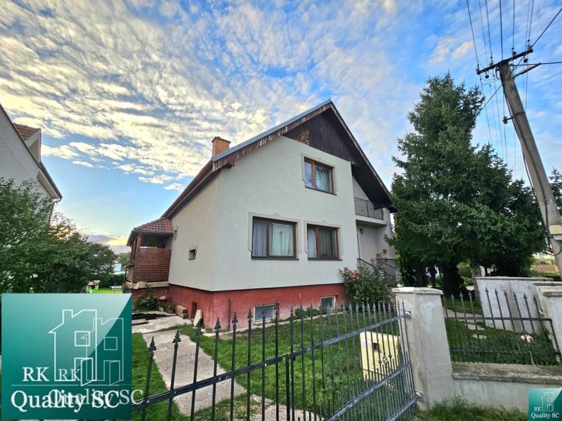 A family house in the village of Tureň on Tureň street, surrounded by greenery and fencing.