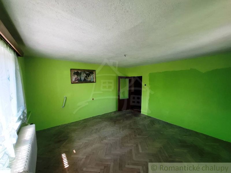 Green walls in the family house and flooring with a wood decor.