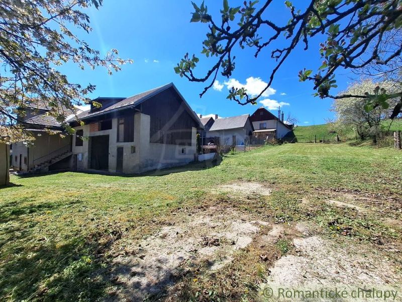A family house in the village of Heľpa with a large, sunny garden and a rural setting.