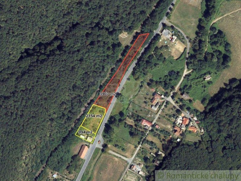 An aerial view of residential plots in Šiatorská Bukovinka, surrounded by forest and nature.
