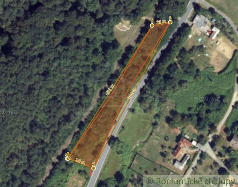 Plots - housing in Šiatorská Bukovinka surrounded by greenery and road network.