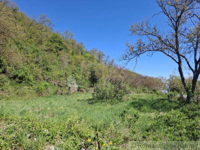 A hilly landscape in Šiatorská Bukovinka with a grassy plot for living.