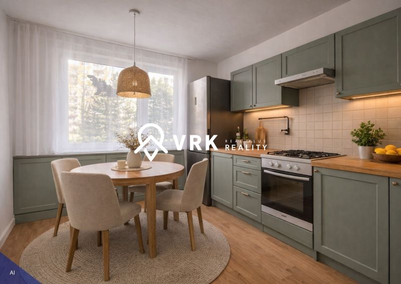 A kitchen in a 4-room apartment with a wooden decor floor and a round table.