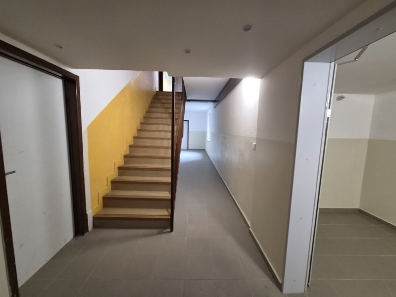 Hallway in the building with stairs and entrances on SNP Quarter, Trenčianske Teplice.