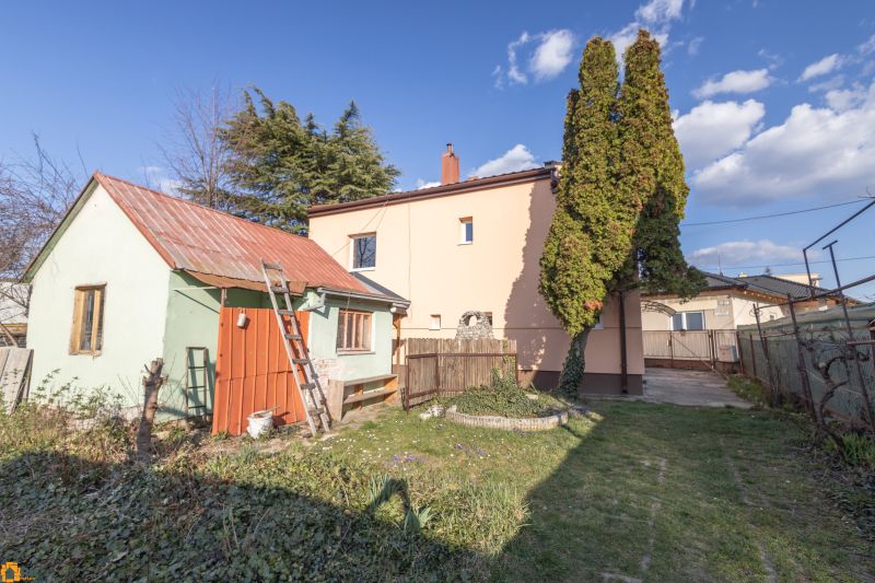 A family house on Mlynska Street in Piešťany, with an adjacent building and a garden.