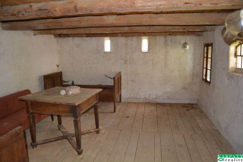 A room in a family house with wooden furniture and wooden floor decor.