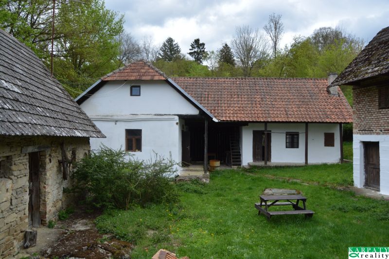A traditional family house in Bukovec with historical features and a garden in the countryside.