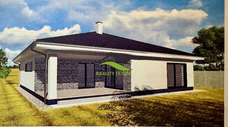 A family house in Dúbravka with a flat roof, terrace, and surrounding greenery.