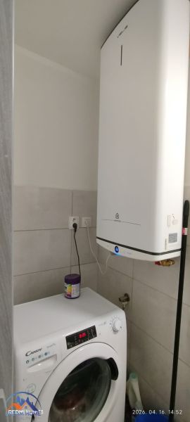 Washing machine and boiler in the bathroom of a 2-room apartment with a practical layout.
