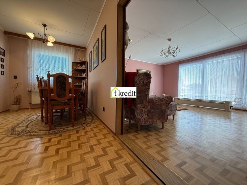 Interior of a family house with wooden floor decor and a separate dining room and living room.