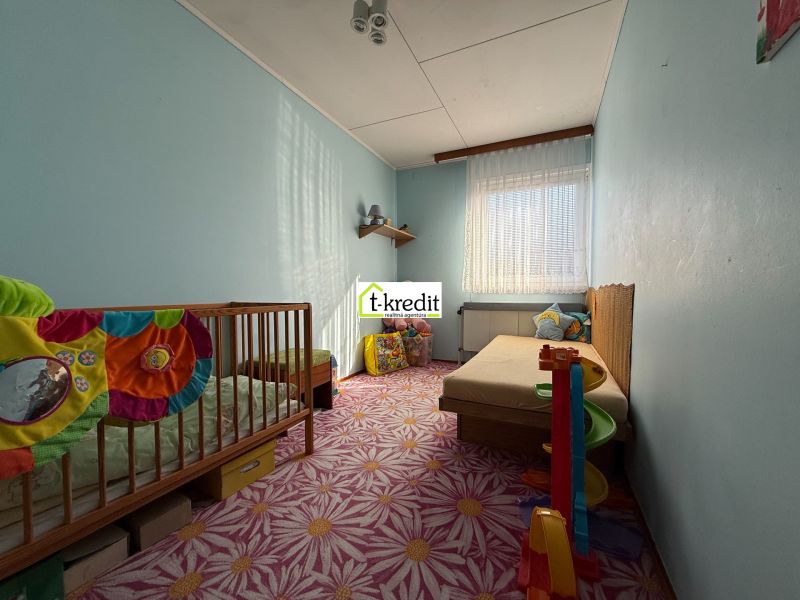 Children's room with pastel walls and carpet, interior of a family house.