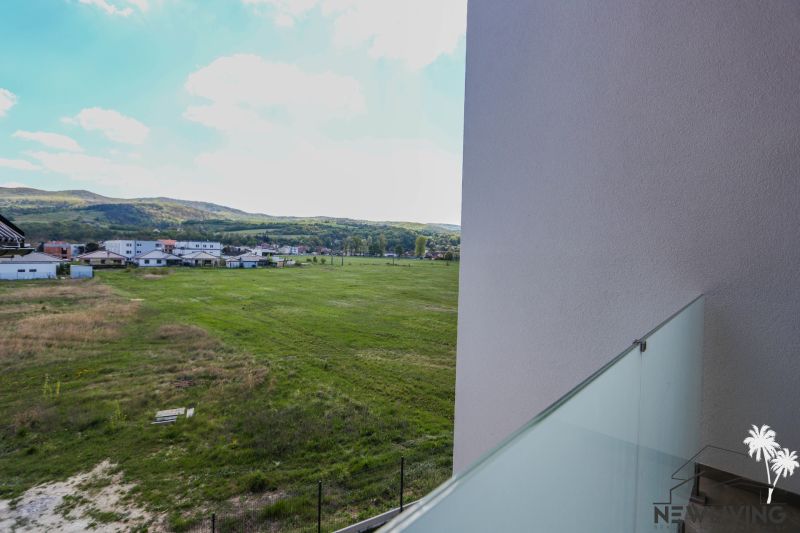 View from a 4-room apartment on Moravanská Street in Banka, green fields and landscape.