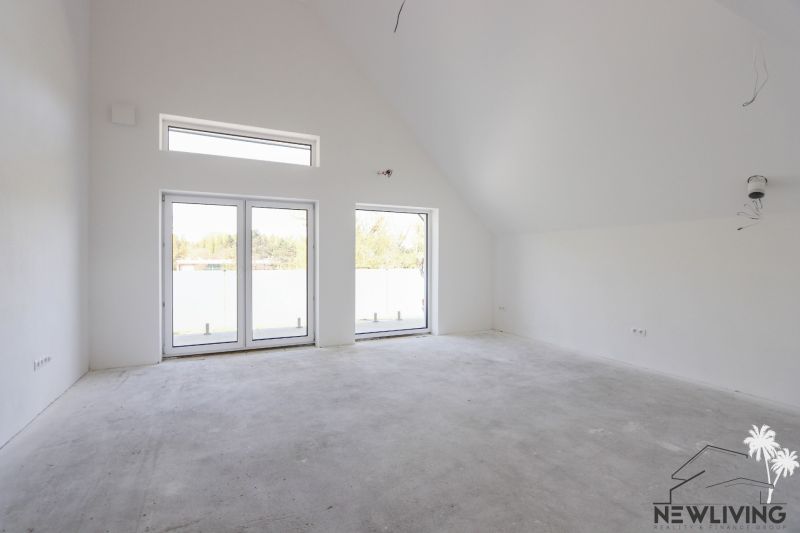 An unfurnished room with large windows in a 4-room apartment.