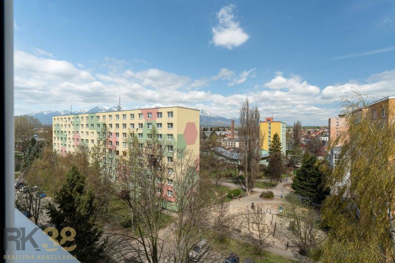 A view from a 4-room apartment on Partizánska Street in Poprad of the surrounding greenery and apartment buildings.